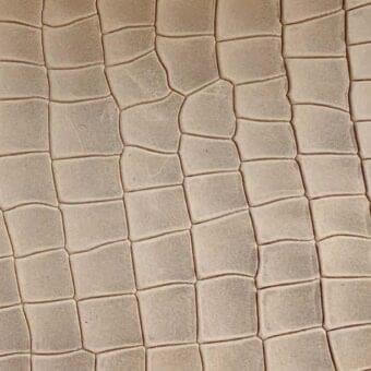 Printed leather texture, beige crocodile pattern, square grid with rounded edges, matte finish, Rugiano collection sample.